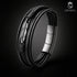 Geflochtenes Lederarmband mit silberfarbenem Feder Charm – Unisex Accessoire von Uniqal
